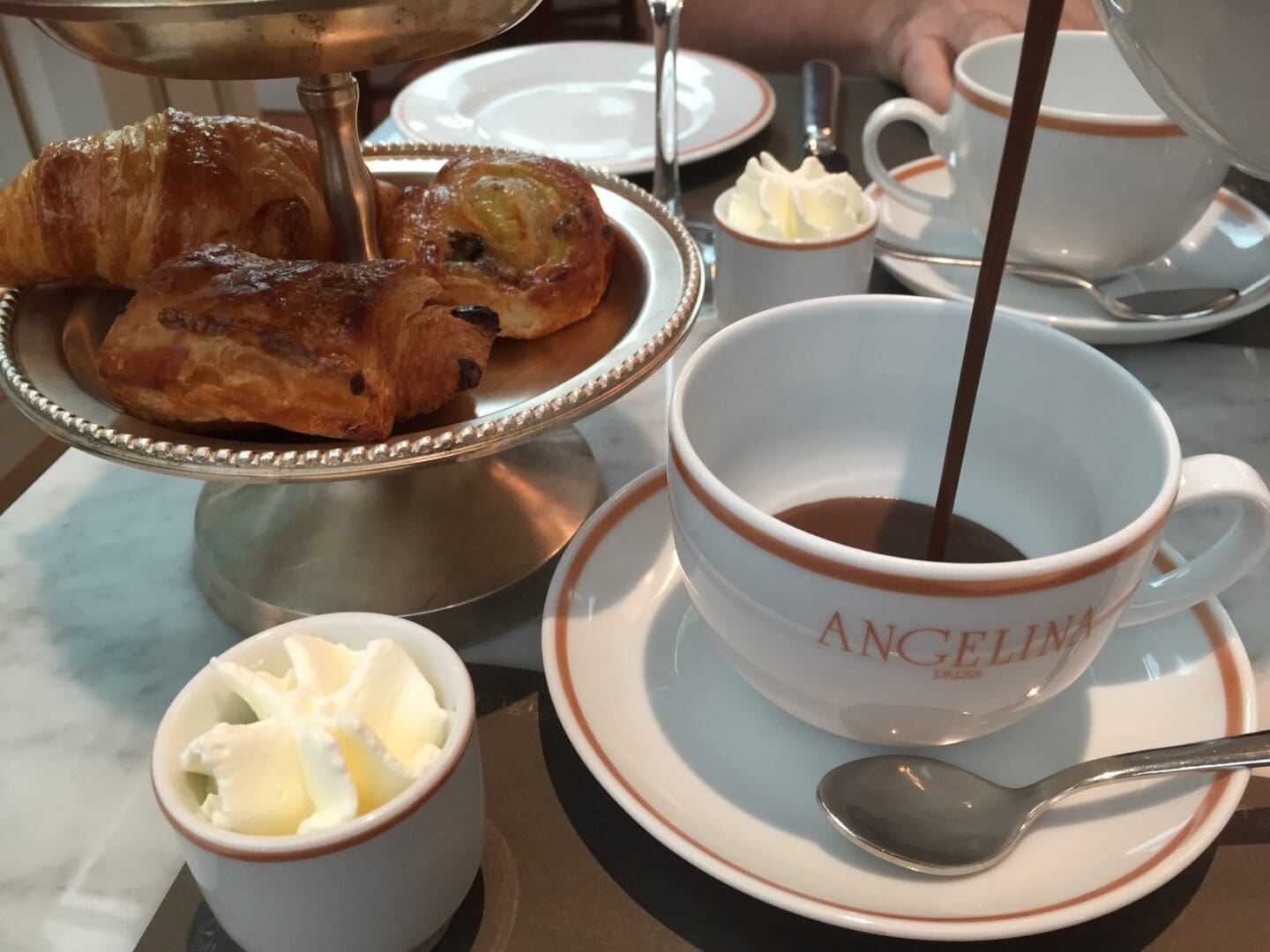 Chocolate Being Poured onto a White Cup