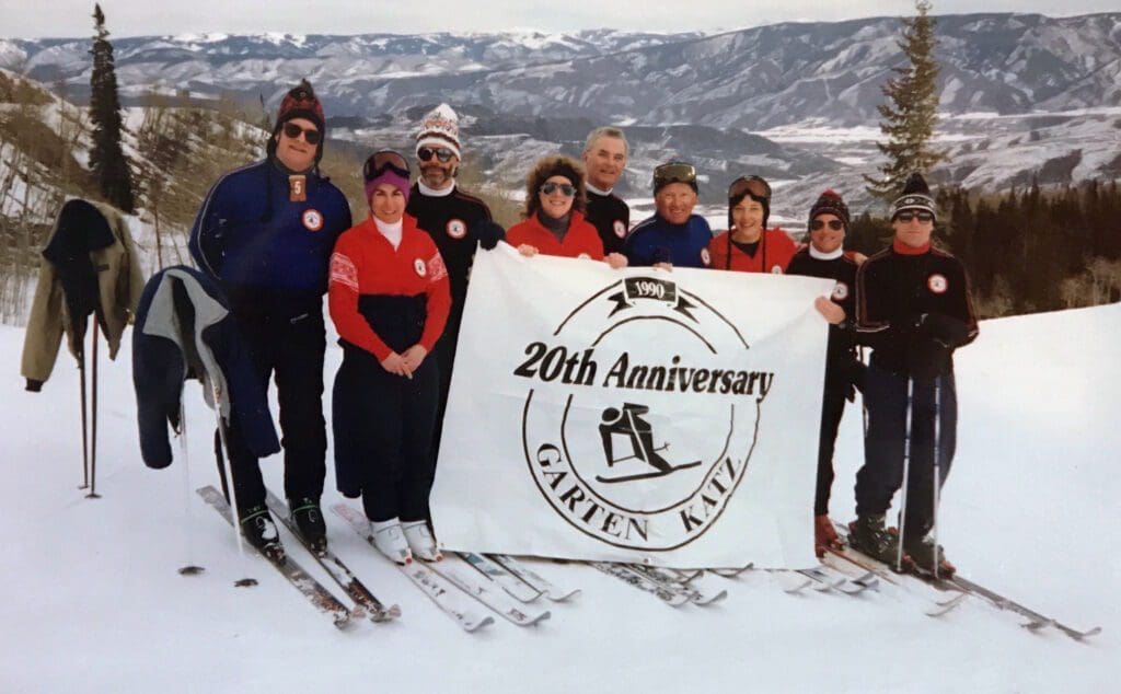 A Group of People Holding a Anniversary Banner
