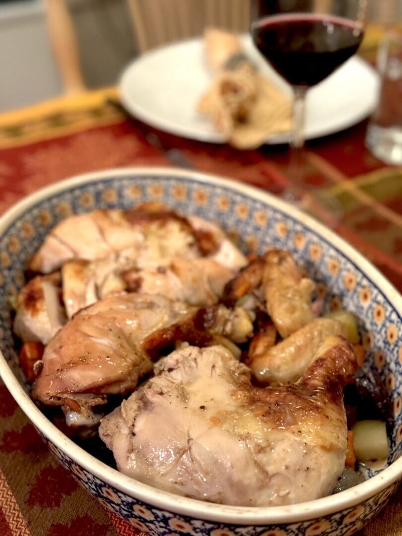 Roasted chicken with vegetables in a bowl.