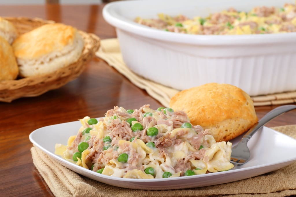 Tuna noodle casserole with peas and biscuits.