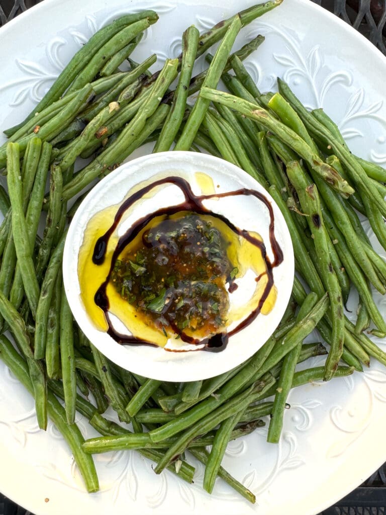 Grilled green beans with a balsamic vinaigrette dip.