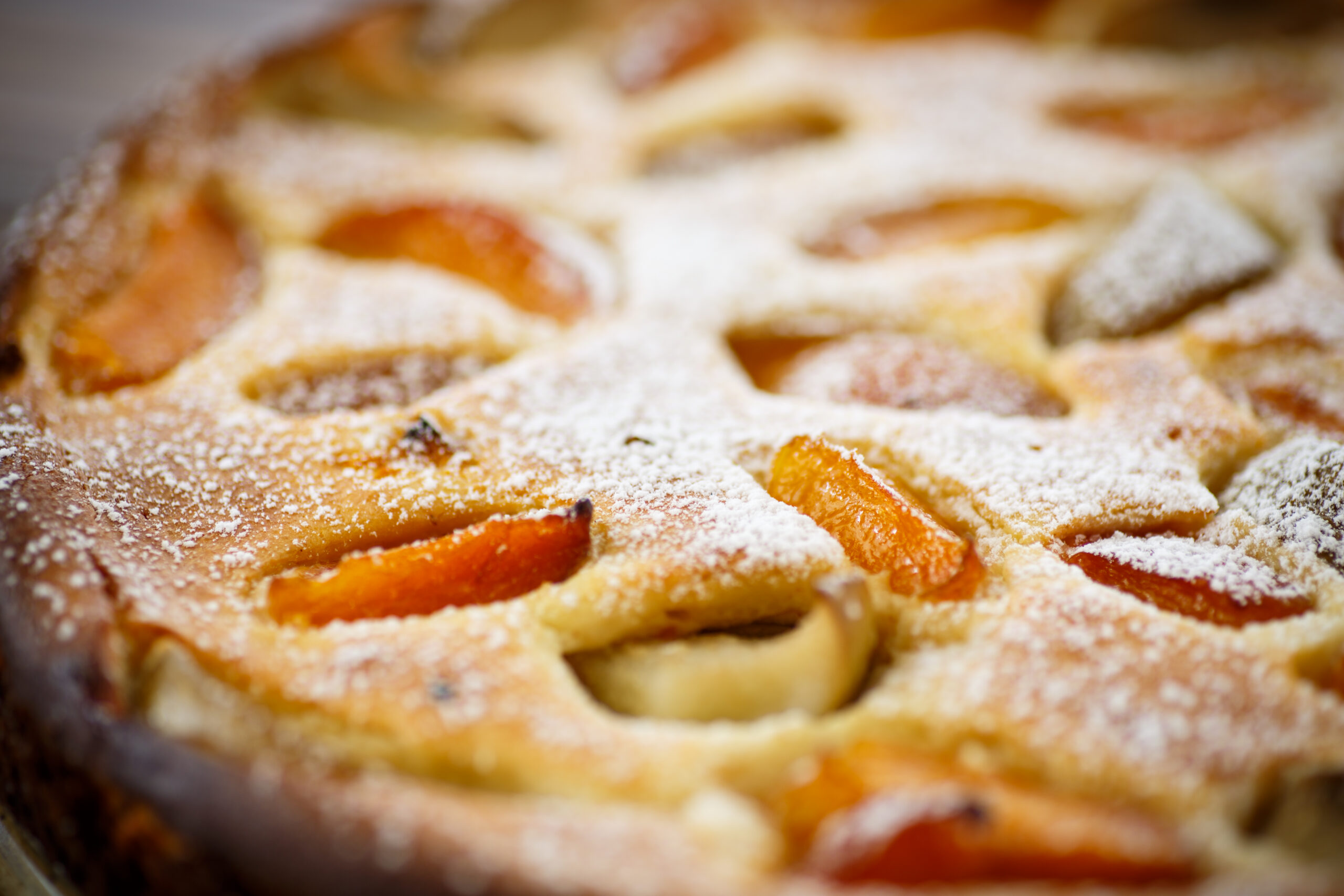 Cottage cheese casserole with apricots on a wooden table