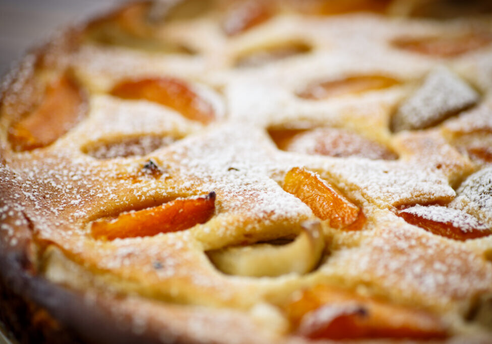Cottage cheese casserole with apricots on a wooden table