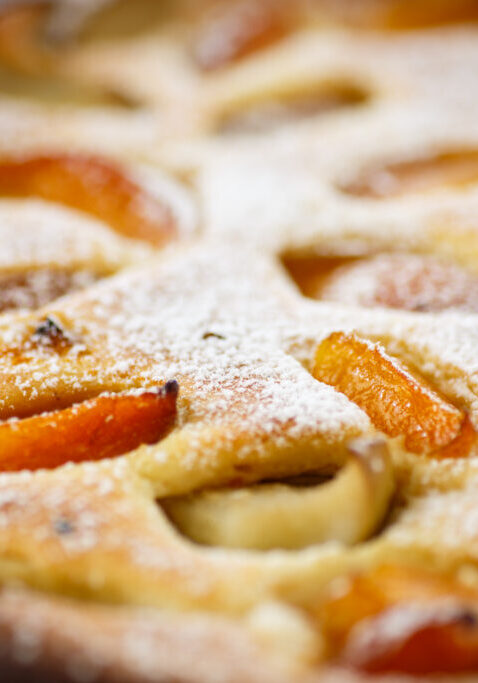 Cottage cheese casserole with apricots on a wooden table
