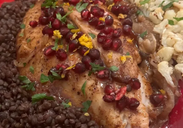 Fish with lentils, cauliflower, and pomegranate seeds.