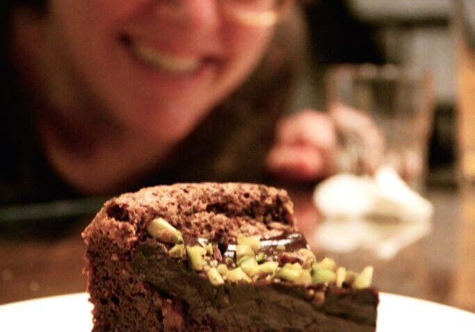 A piece of chocolate cake on a plate.