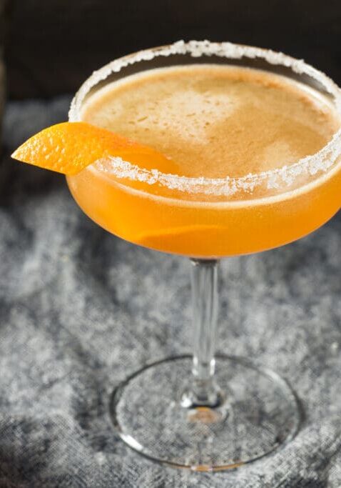 Orange peel garnish in a cocktail glass.