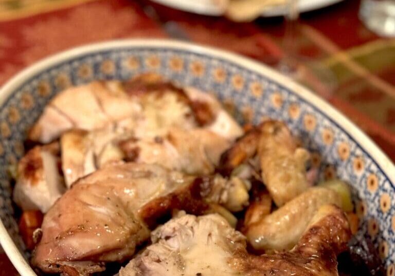 Roasted chicken with vegetables in a bowl.