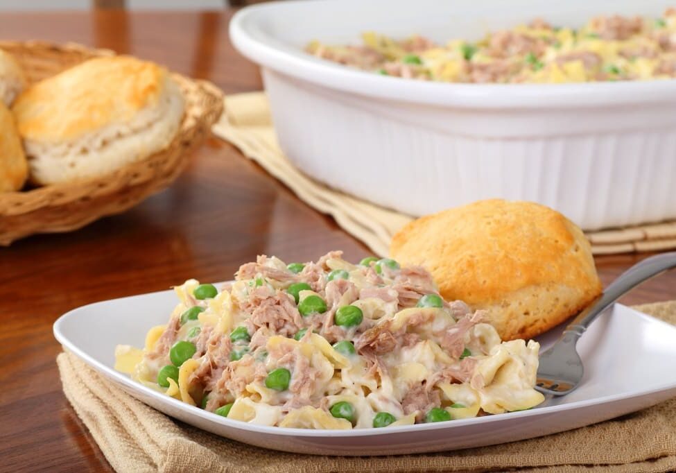 Tuna noodle casserole with peas and biscuits.